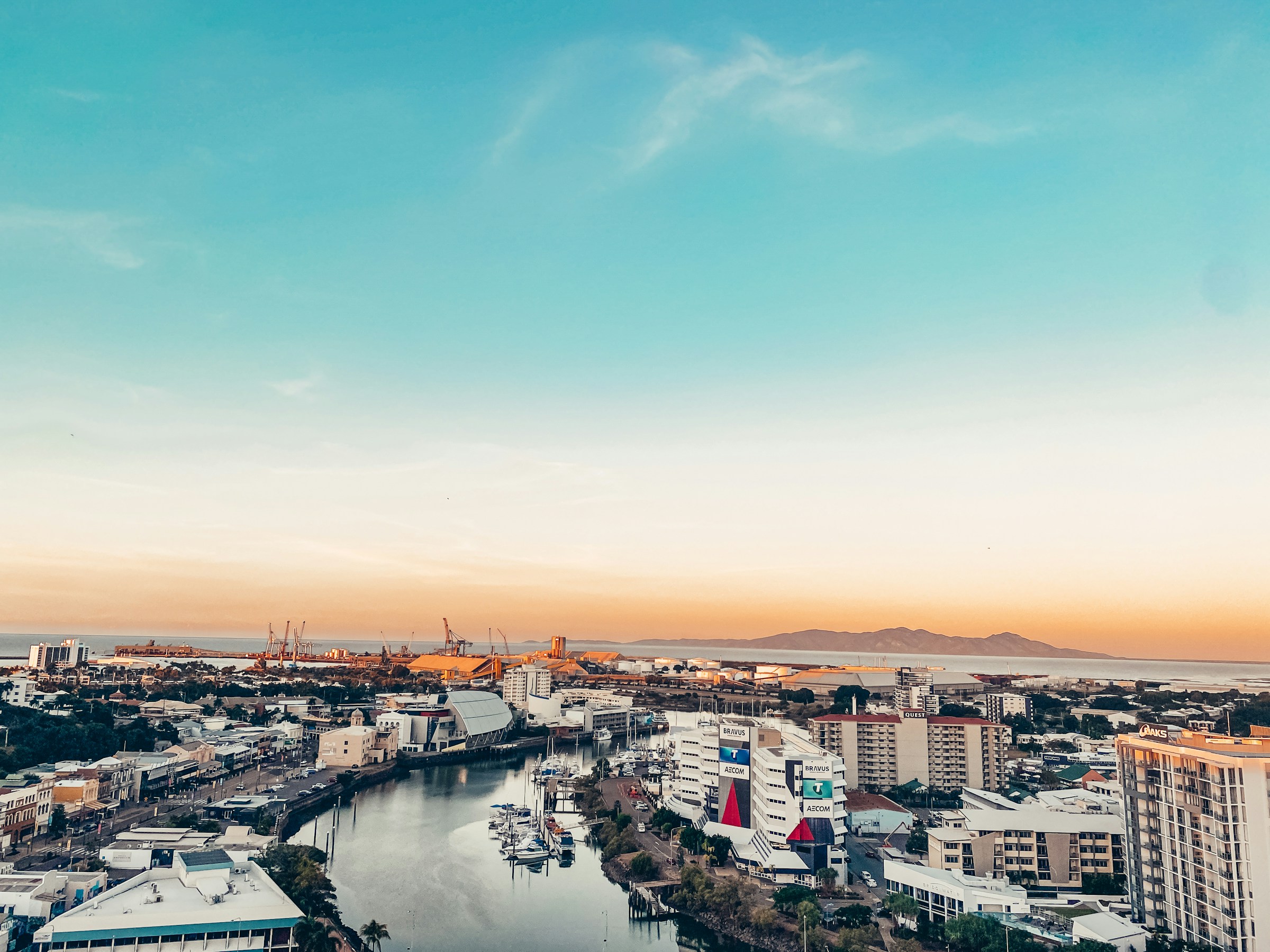 Townsville and Ross Creek at dusk, Magnetic Island beyond — Townsville's home market